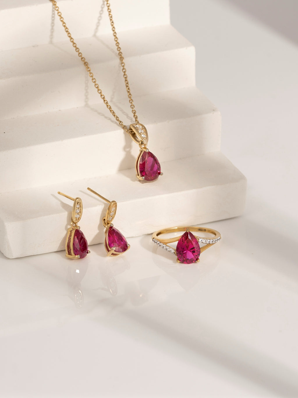Pear Cut Created Ruby With Lab Grown Diamond Accent Pendant Necklace