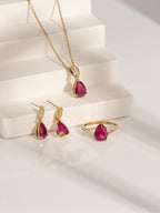 Pear Cut Created Ruby With Lab Grown Diamond Accent Pendant Necklace