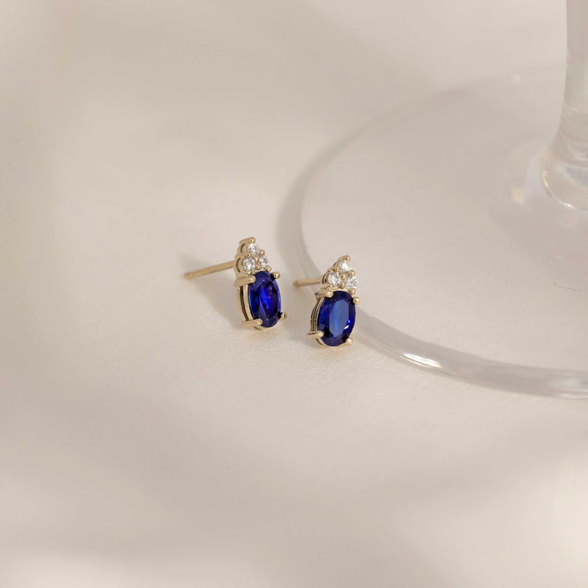 Oval Cut Sapphire With Trio Lab Grown Diamond Stud Earrings