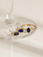 Oval Cut Created Sapphire With Trio Lab Grown Diamond On Shank Engagement Ring