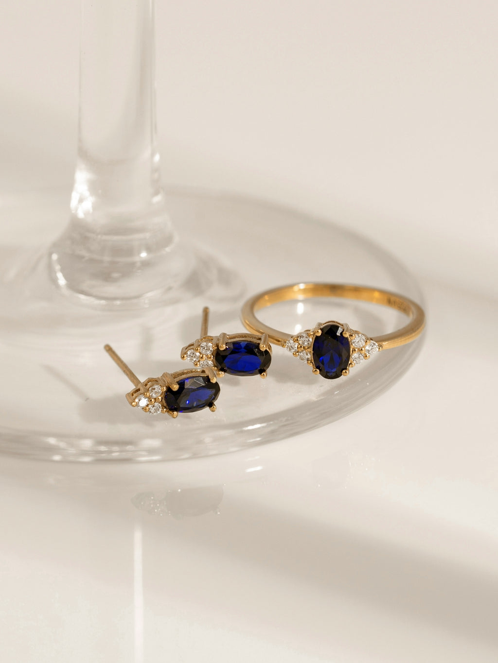 Oval Cut Created Sapphire With Trio Lab Grown Diamond Accent Stud Earrings