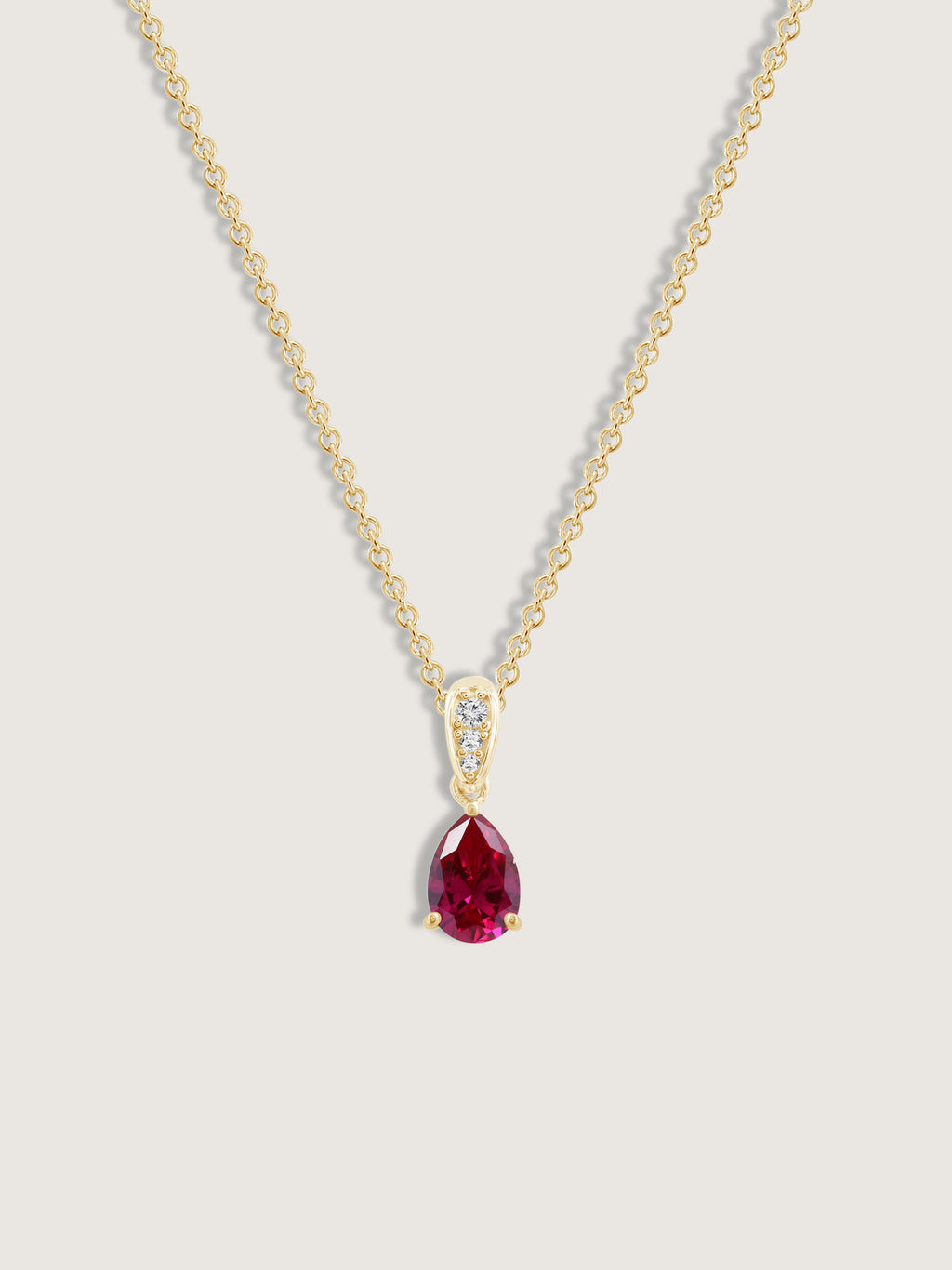 Pear Cut Created Ruby With Lab Grown Diamond Accent Pendant Necklace