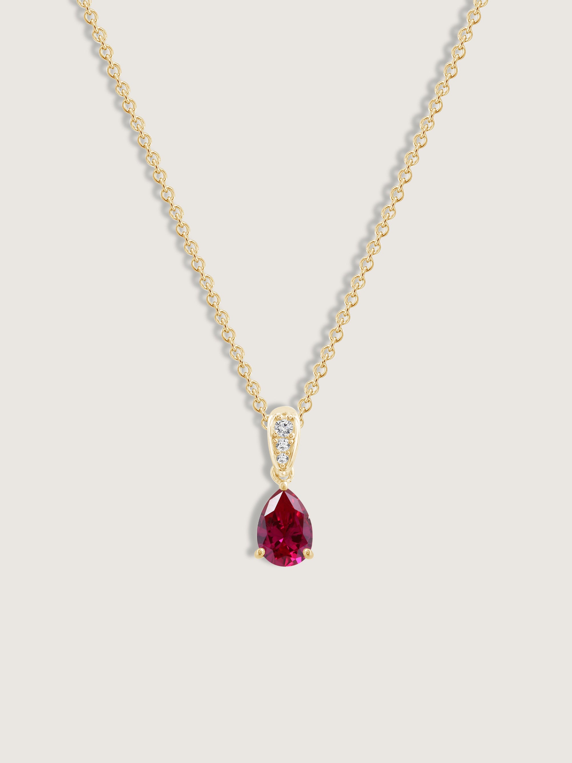 Pear Cut Created Ruby With Lab Grown Diamond Accent Pendant Necklace