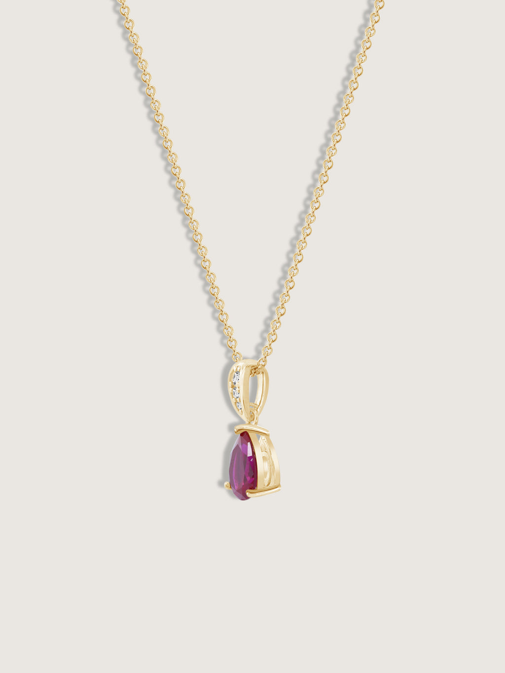 Pear Cut Created Ruby With Lab Grown Diamond Accent Pendant Necklace