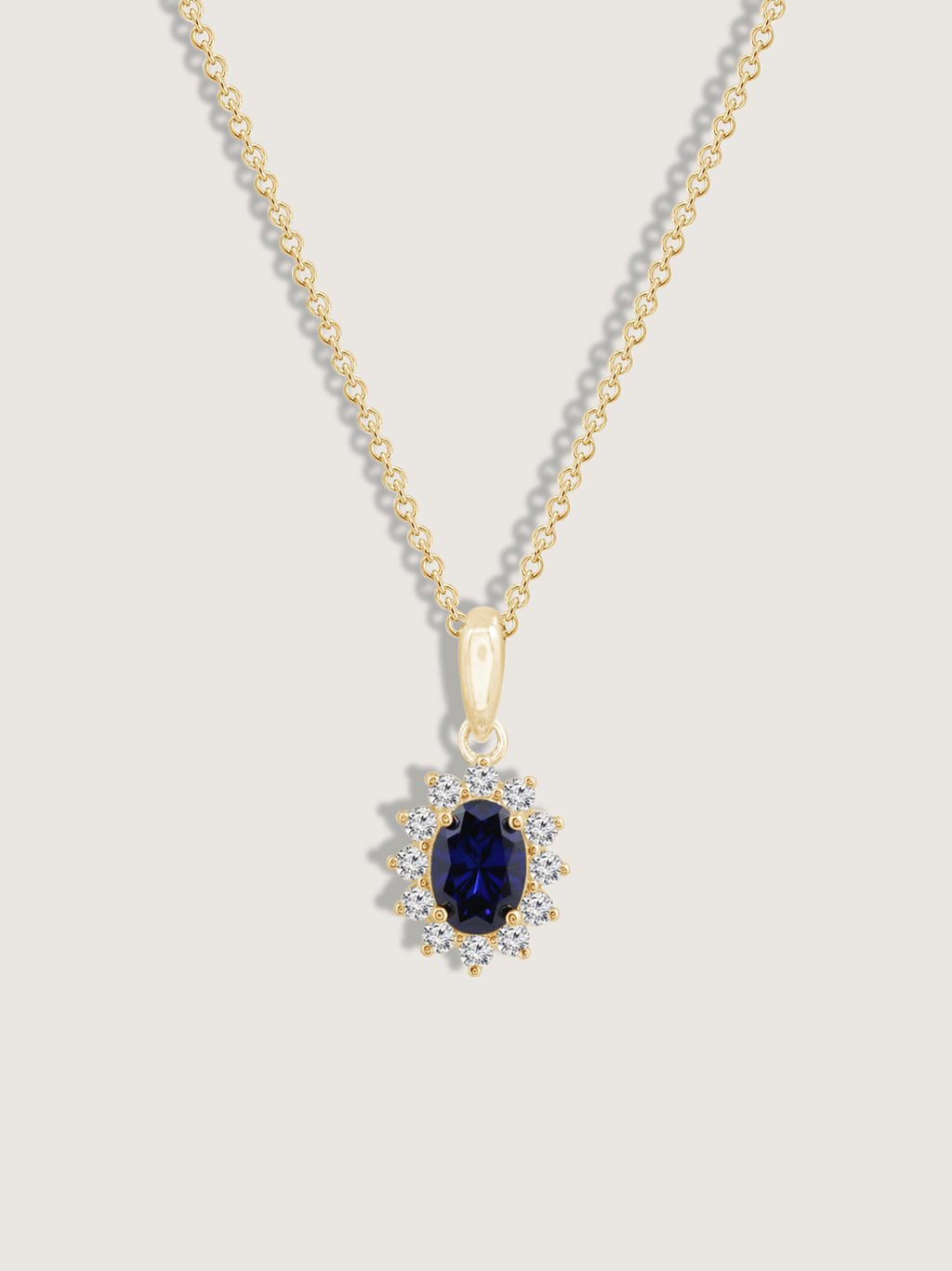 Oval Cut Created Sapphire With Lab Grown Diamond Accent Halo Pendant Necklace