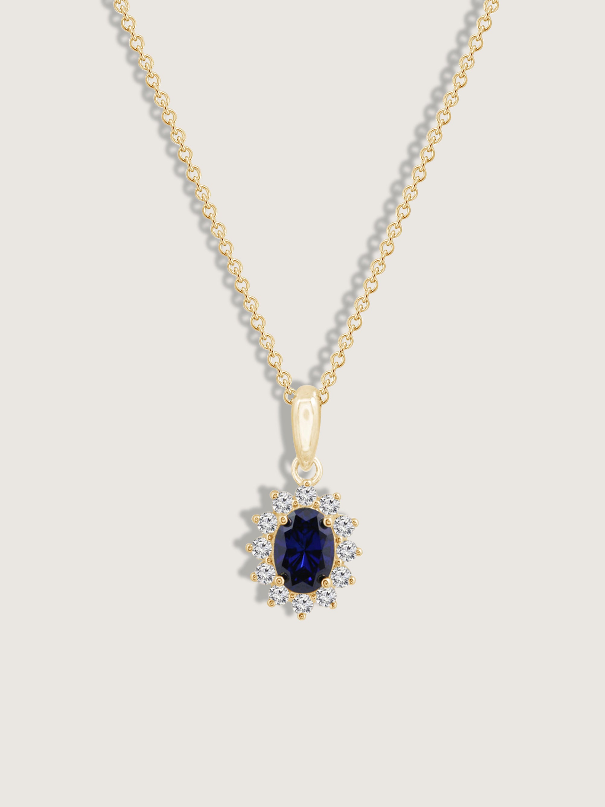 Oval Cut Created Sapphire With Lab Grown Diamond Accent Halo Pendant Necklace