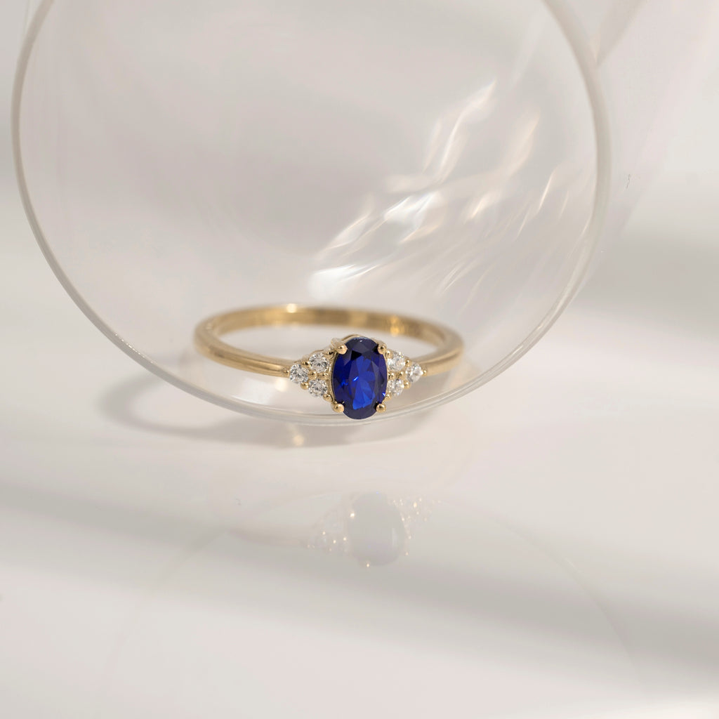 Oval Cut Sapphire With Trio Lab Grown Diamond On Shank Engagement Ring
