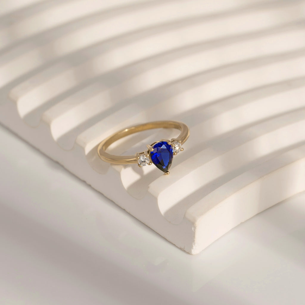 Pear Cut Sapphire With Lab Grown Diamond Three Stones Ring