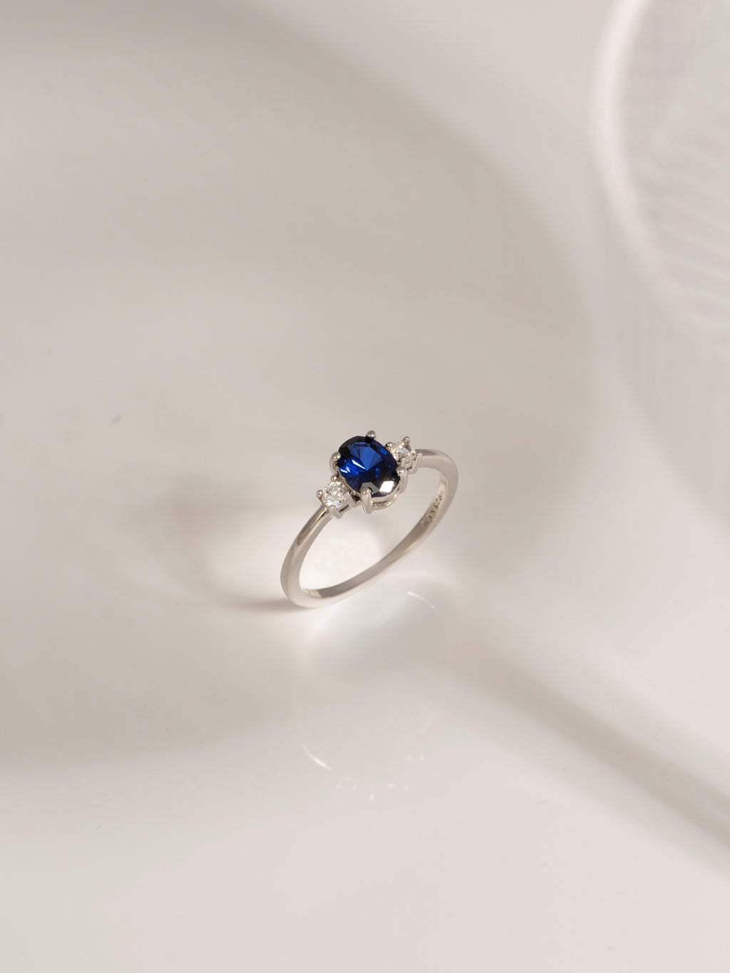 Oval Cut Created Sapphire And Lab Grown Diamond Three Stones Ring