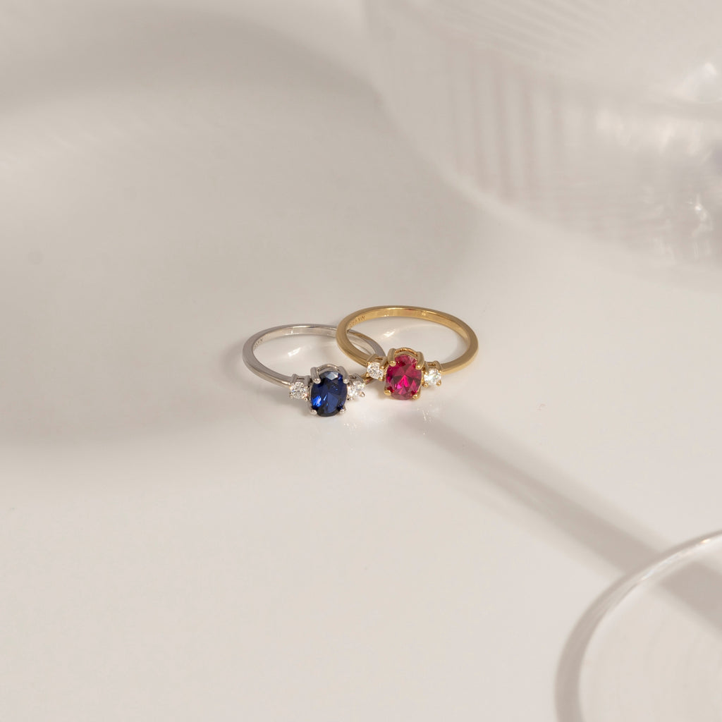 Oval Cut Created Ruby And Lab Grown Diamond Three Stones Ring