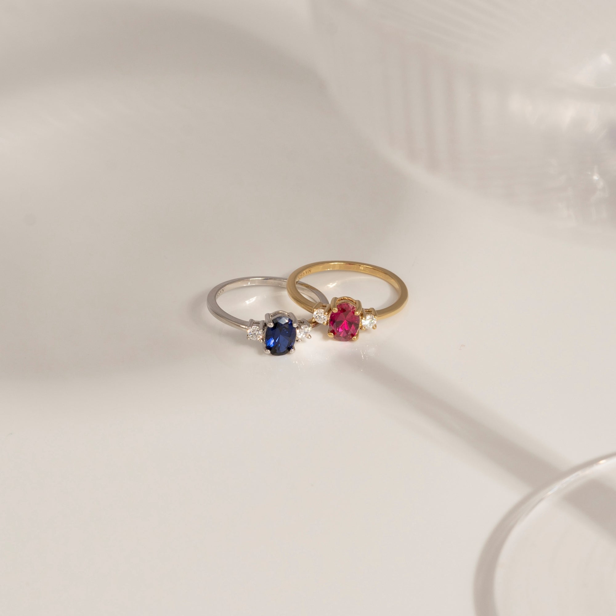Oval Cut Created Ruby And Lab Grown Diamond Three Stones Ring